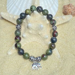 Beaded bracelet-marble stone beads with silver tone accent beads+ elephant charm